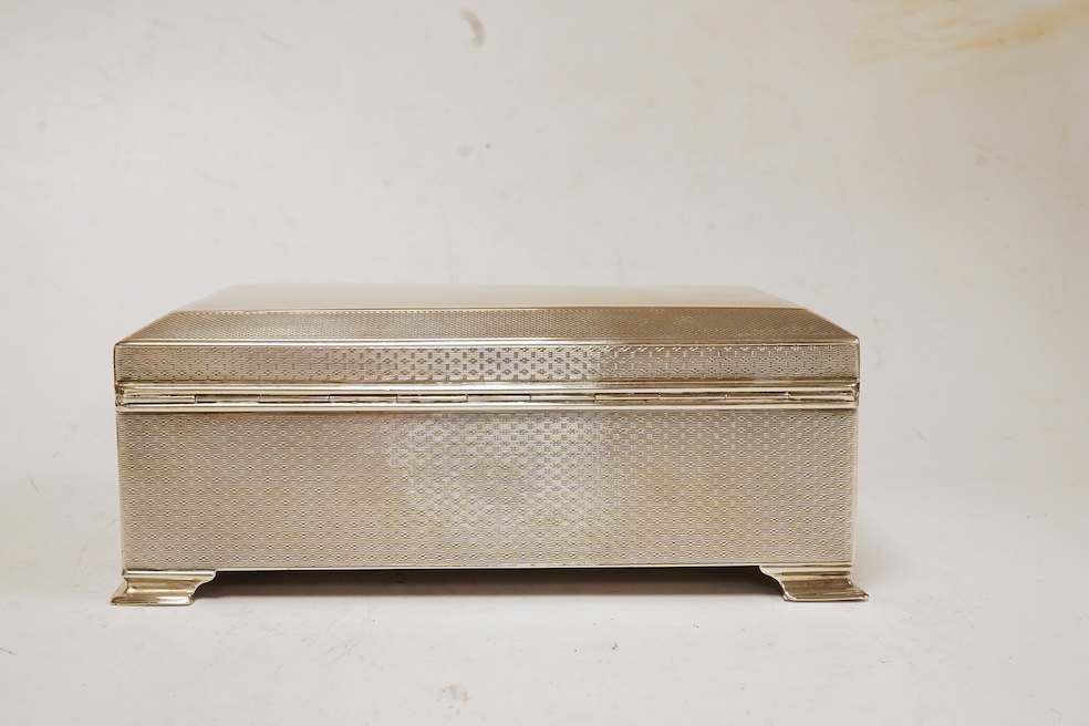 A George V engine turned silver mounted rectangular cigarette box, by Colen Hewer Cheshire, Chester, 1924, 16.6cm. Condition - poor to fair